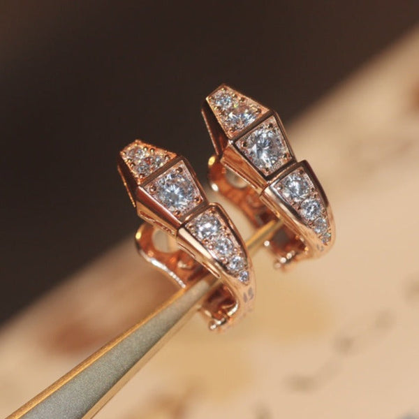 <magic> Schlangenohrringe aus Roségold mit Diamanten</magic>